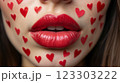 Close-up of beautiful aesthetic lips with red lipstick filled with decorative hearts around, sexy and sensual atmosphere 123303222