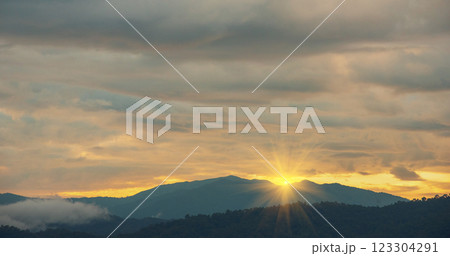 Scenic view dramatic beautiful sunset sky. Natural Sunset Sunrise on meadow silhouette shadow dark land. Vibrant dramatic sky on sunset, dawn, sunrise in Countryside. Landscape Colorful Sky At Sunset 123304291
