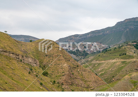 A mountain range with a small town in the valley A mountain range with a small town in the valley 123304528