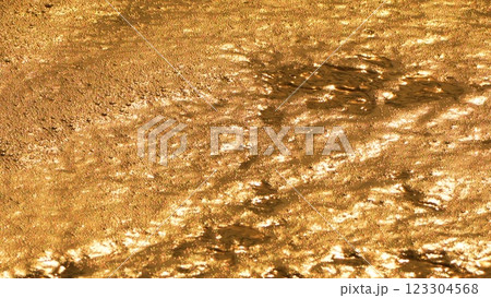 Water, Ripples, Sunlight - Close-up of glistening water surface reflecting sunlight. 123304568