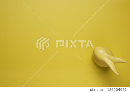 Yellow empty background with easter bunny 123304951