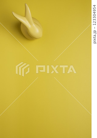 Yellow empty background with easter bunny Yellow empty background with easter bunny 123304954