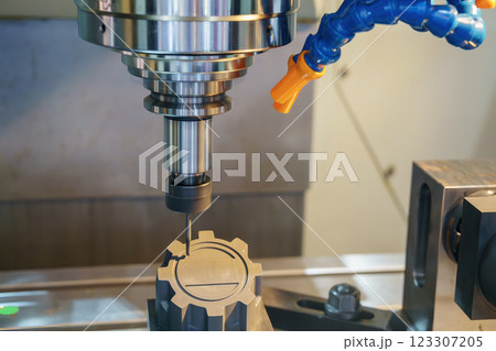 The CNC milling machine cutting the graphite electrode parts. The CNC milling machine cutting the graphite electrode parts. 123307205