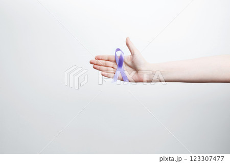 Purple Epilepsy Awareness Day, purple ribbon held, symbol of support 123307477