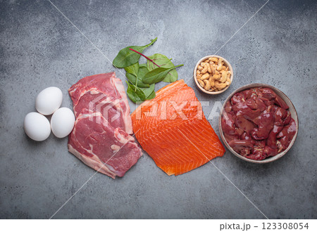 Food ingredients high in iron for health and wellness top view on grey concrete background Food ingredients high in iron for health and wellness top view on grey concrete background 123308054