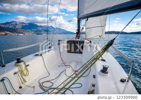 Sports yacht sailing in the Kotor Bay, Montenegro, representing adventure, freedom, and nautical exploration. 123309900