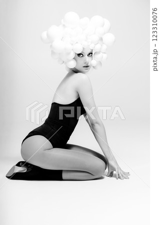 Avant-Garde Fashion Pose with Balloon Headdress Avant-Garde Fashion Pose with Balloon Headdress 123310076