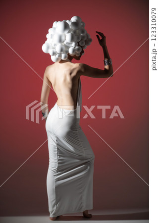 Avant-Garde Fashion Pose with Spherical Headpiece Avant-Garde Fashion Pose with Spherical Headpiece 123310079