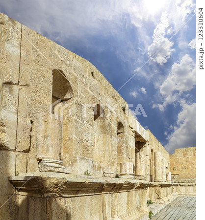 Roman ruins (against the background of a beautiful sky with clouds) in the Jordanian city of Jerash (Gerasa of Antiquity), capital and largest city of Jerash Governorate, Jordan Roman ruins (against the background of a beautiful sky with clouds) in the Jordanian city of Jerash (Gerasa of Antiquity), capital and largest city of Jerash Governorate, Jordan 123310604