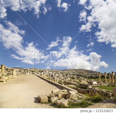 Roman ruins (against the background of a beautiful sky with clouds) in the Jordanian city of Jerash (Gerasa of Antiquity), capital and largest city of Jerash Governorate, Jordan Roman ruins (against the background of a beautiful sky with clouds) in the Jordanian city of Jerash (Gerasa of Antiquity), capital and largest city of Jerash Governorate, Jordan 123310621