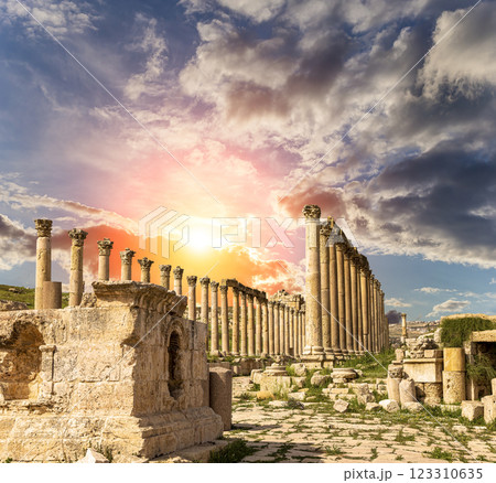 Roman ruins (against the background of a beautiful sky with clouds) in the Jordanian city of Jerash (Gerasa of Antiquity), capital and largest city of Jerash Governorate, Jordan Roman ruins (against the background of a beautiful sky with clouds) in the Jordanian city of Jerash (Gerasa of Antiquity), capital and largest city of Jerash Governorate, Jordan 123310635