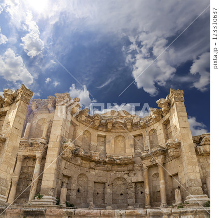 Roman ruins (against the background of a beautiful sky with clouds) in the Jordanian city of Jerash (Gerasa of Antiquity), capital and largest city of Jerash Governorate, Jordan Roman ruins (against the background of a beautiful sky with clouds) in the Jordanian city of Jerash (Gerasa of Antiquity), capital and largest city of Jerash Governorate, Jordan 123310637