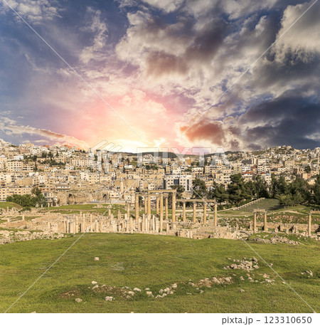 Roman ruins (against the background of a beautiful sky with clouds) in the Jordanian city of Jerash (Gerasa of Antiquity), capital and largest city of Jerash Governorate, Jordan Roman ruins (against the background of a beautiful sky with clouds) in the Jordanian city of Jerash (Gerasa of Antiquity), capital and largest city of Jerash Governorate, Jordan 123310650