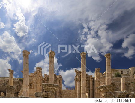 Roman ruins (against the background of a beautiful sky with clouds) in the Jordanian city of Jerash (Gerasa of Antiquity), capital and largest city of Jerash Governorate, Jordan Roman ruins (against the background of a beautiful sky with clouds) in the Jordanian city of Jerash (Gerasa of Antiquity), capital and largest city of Jerash Governorate, Jordan 123310661