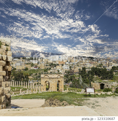 Roman ruins (against the background of a beautiful sky with clouds) in the Jordanian city of Jerash (Gerasa of Antiquity), capital and largest city of Jerash Governorate, Jordan 123310687