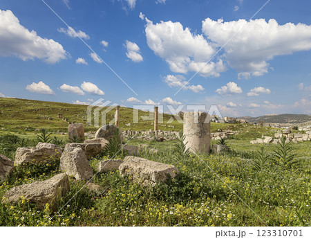 Roman ruins (against the background of a beautiful sky with clouds) in the Jordanian city of Jerash (Gerasa of Antiquity), capital and largest city of Jerash Governorate, Jordan Roman ruins (against the background of a beautiful sky with clouds) in the Jordanian city of Jerash (Gerasa of Antiquity), capital and largest city of Jerash Governorate, Jordan 123310701