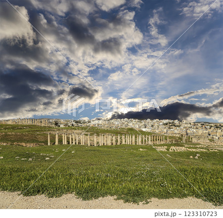 Roman ruins (against the background of a beautiful sky with clouds) in the Jordanian city of Jerash (Gerasa of Antiquity), capital and largest city of Jerash Governorate, Jordan Roman ruins (against the background of a beautiful sky with clouds) in the Jordanian city of Jerash (Gerasa of Antiquity), capital and largest city of Jerash Governorate, Jordan 123310723