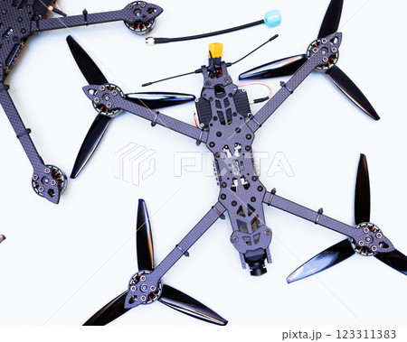 FPV drone in production on white background. FPV drone in production on white background. 123311383