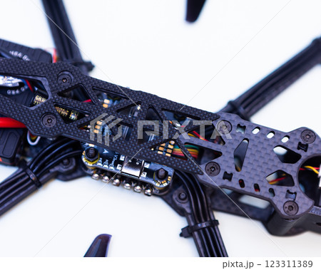 FPV drone in production on white background. 123311389