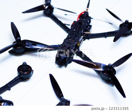 FPV drone in production on white background. 123311395