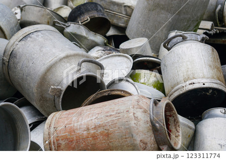 Large pile of various old aluminum pots and cans, aluminum scrap background Large pile of various old aluminum pots and cans, aluminum scrap background 123311774