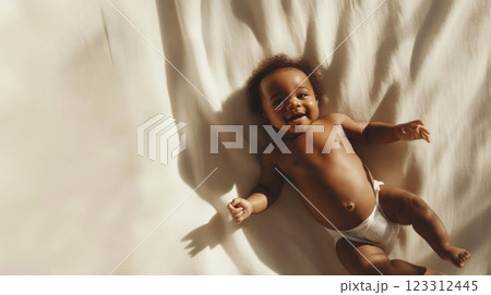 adorable infant lying on a white fabric surface, smiling with bright eyes, reaching hands and feet, warm and soft shadows, natural baby pose, photorealistic detail, minimalistic setting, concept of 123312445