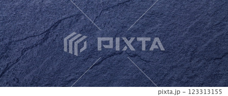 Navy blue background of natural slate. Texture of ultramarine stone closeup. Graphite material backdrop macro. 123313155