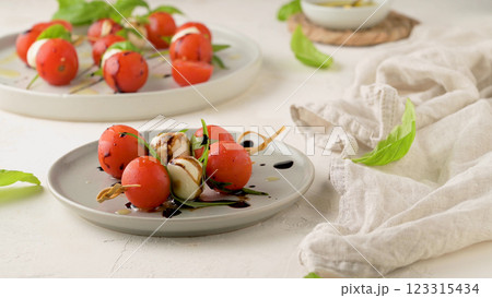 Caprese salad with tomato and mozzarella Caprese salad with tomato and mozzarella 123315434