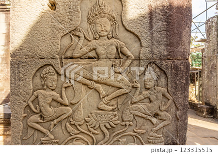 Ancient Bayon ruined temple walls decorated with dancing apsaras statues, Angkor Archaeological Park, Siem Reap, Cambodia Ancient Bayon ruined temple walls decorated with dancing apsaras statues, Angkor Archaeological Park, Siem Reap, Cambodia 123315515