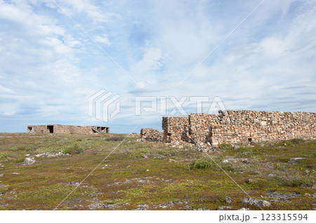 Abandoned ruined stone constructions in tundra Abandoned ruined stone constructions in tundra 123315594