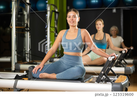 Portrait of a woman on a reformer 123319600