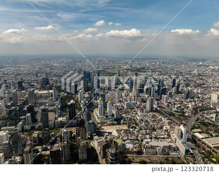 Prominent skyscrapers and urban sprawl make up the bustling Bangkok cityscape under clear skies. Bangkok, Thailand. Prominent skyscrapers and urban sprawl make up the bustling Bangkok cityscape under clear skies. Bangkok, Thailand. 123320718