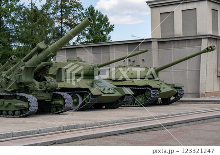 Big green tank at the military base in the city. 123321247