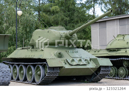 Big green tank at the military base in the city. 123321264