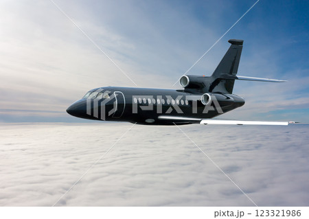 Black modern luxury executive aircraft flies in the air above the clouds 123321986