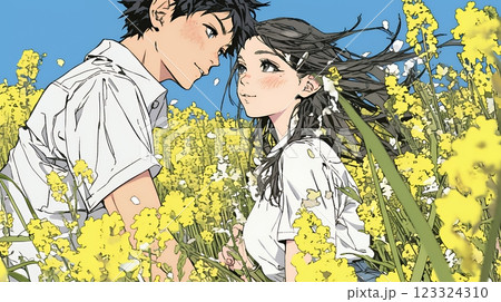 菜の花畑でデートをしている若いカップル