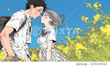 菜の花畑でデートをしている若いカップル