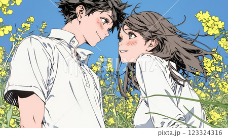 菜の花畑でデートをしている若いカップル