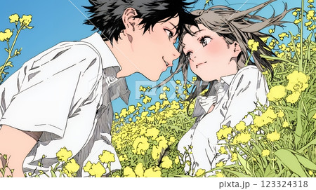 菜の花畑でデートをしている若いカップル