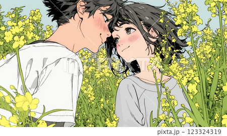 菜の花畑でデートをしている若いカップル