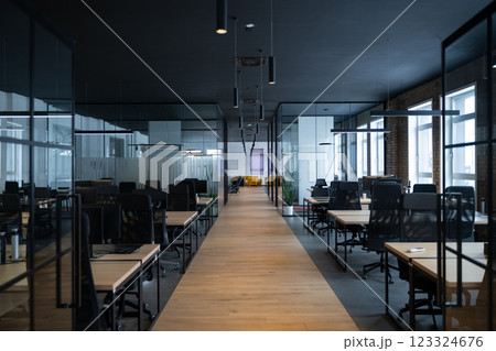 Modern business, glass-walled startup office, open and spacious workspace exudes a modern and innovative vibe, fostering a dynamic atmosphere that supports creativity, collaboration, and business Modern business, glass-walled startup office, open and spacious workspace exudes a modern and innovative vibe, fostering a dynamic atmosphere that supports creativity, collaboration, and business 123324676