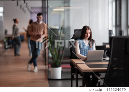 Senior bearded businessman, IT professional, trader, and crypto investor using a digital tablet in a modern coworking space. Tech-savvy professional working in an open office startup environment 123324679