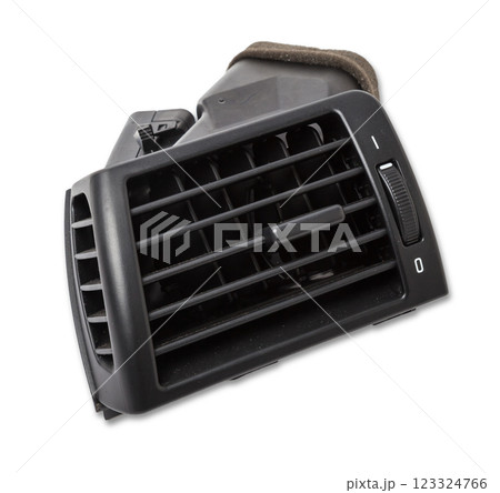 A close-up view of a part of the interior of a modern car with a view of the ventilation deflector of the heater for heating and cooling the passenger compartment. Used auto part catalog from junkyard 123324766