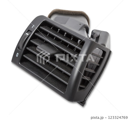 A close-up view of a part of the interior of a modern car with a view of the ventilation deflector of the heater for heating and cooling the passenger compartment. Used auto part catalog from junkyard 123324769