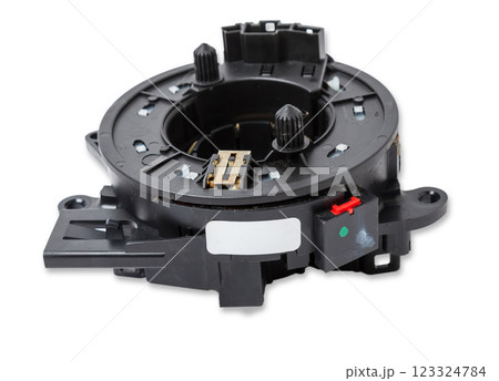 steering angle sensor disassembled on a white isolated background, spare part for car repair or for sale at junk yard. steering angle sensor disassembled on a white isolated background, spare part for car repair or for sale at junk yard. 123324784