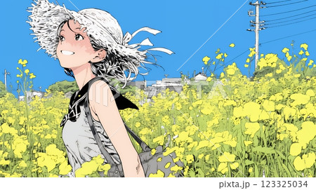 菜の花畑にいる若い女性