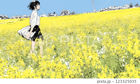 菜の花畑にいる若い女性