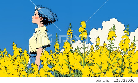 菜の花畑にいる若い女性