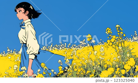 菜の花畑にいる若い女性