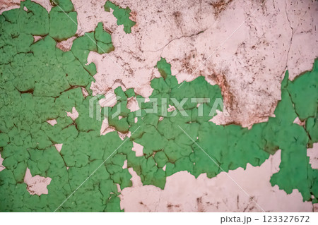 Chipped and peeling lead based paint on an old wall. 123327672